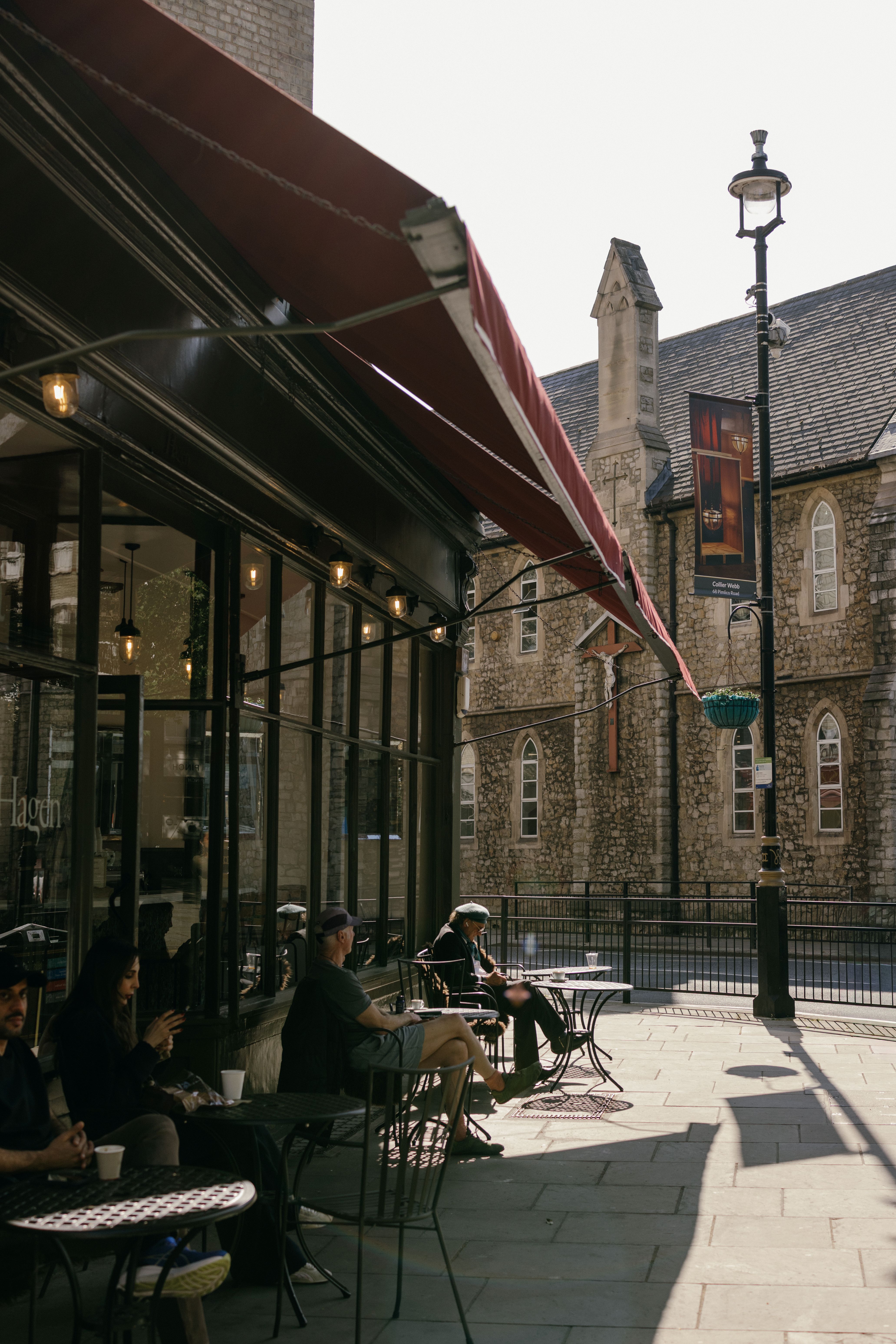 Image of Hagen outside with people sitting on the terrace